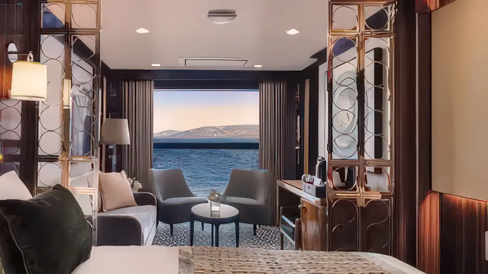 A bright, contemporary suite aboard an Atlas Ocean Voyages yacht