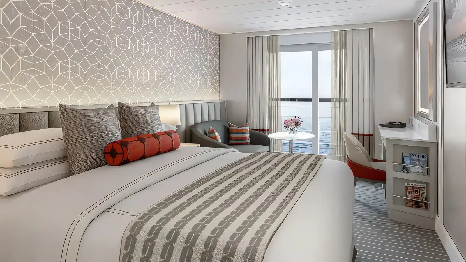 A comfortable Oceania stateroom with a private veranda