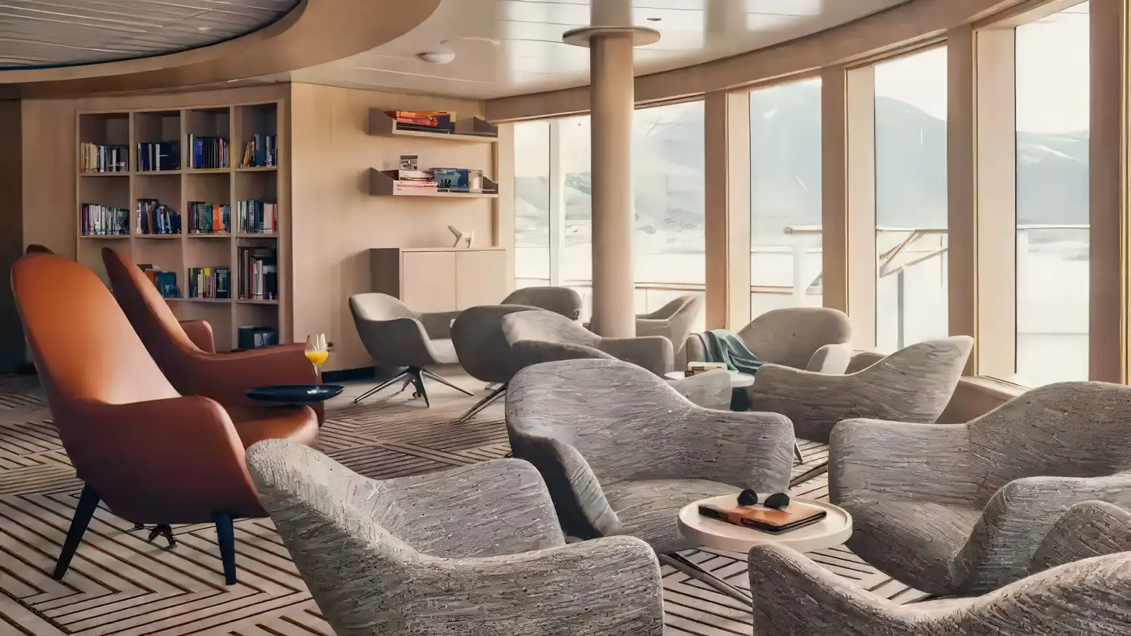 Guests taking in the view from an observation lounge on a Lindblad ship
