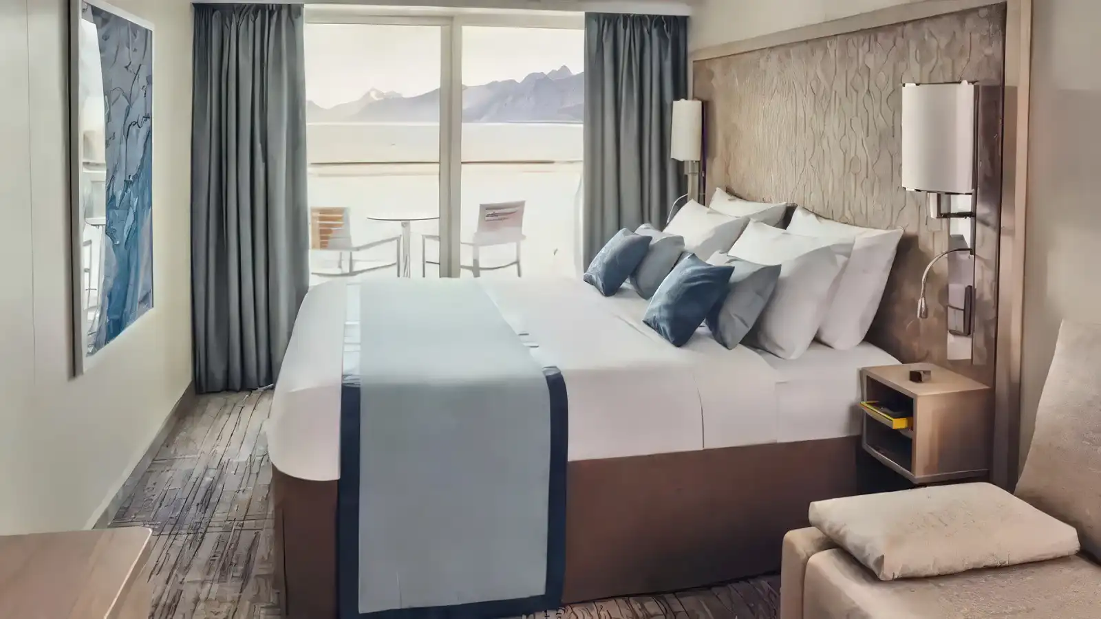 A bright cabin with expedition views aboard a Lindblad ship