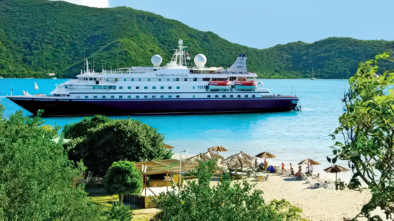 Guests relaxing on a beach during a SeaDream shore day