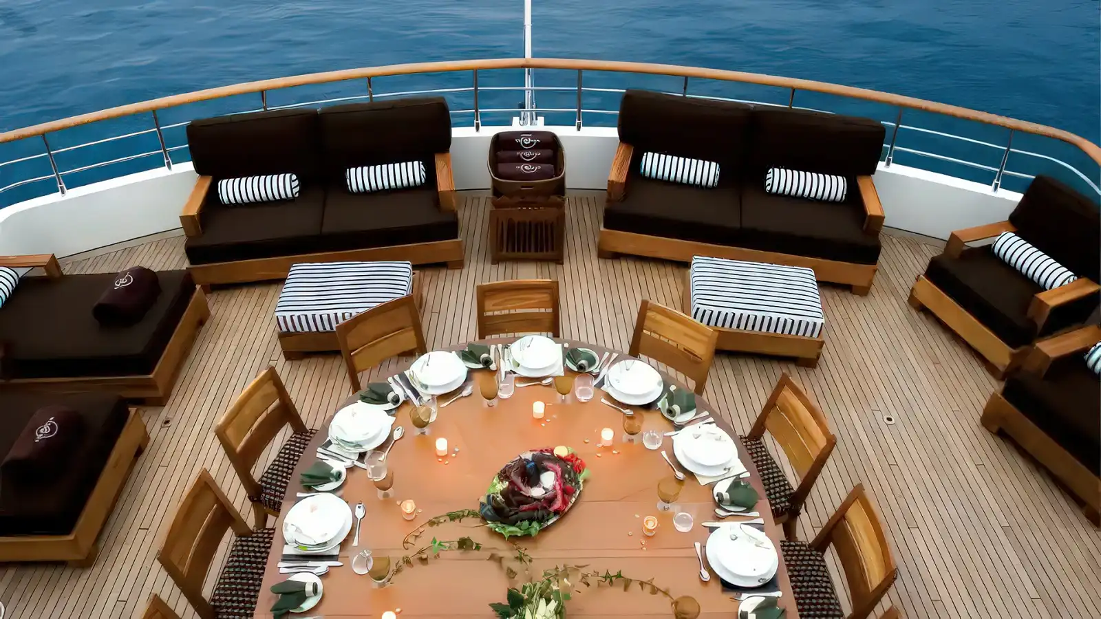 An open-air dining setup on a SeaDream yacht deck