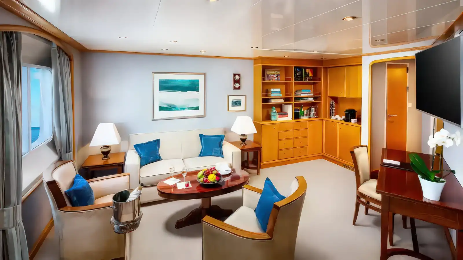 A SeaDream stateroom with warm wood finishes and an ocean view