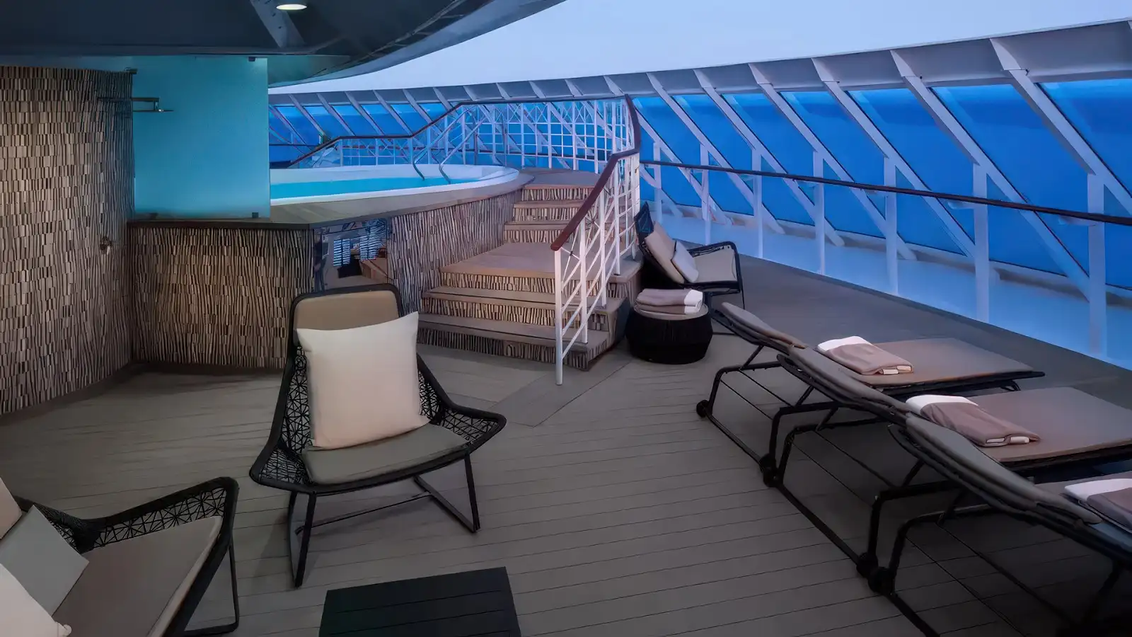 The pool deck of an Azamara boutique ship on a clear day at sea