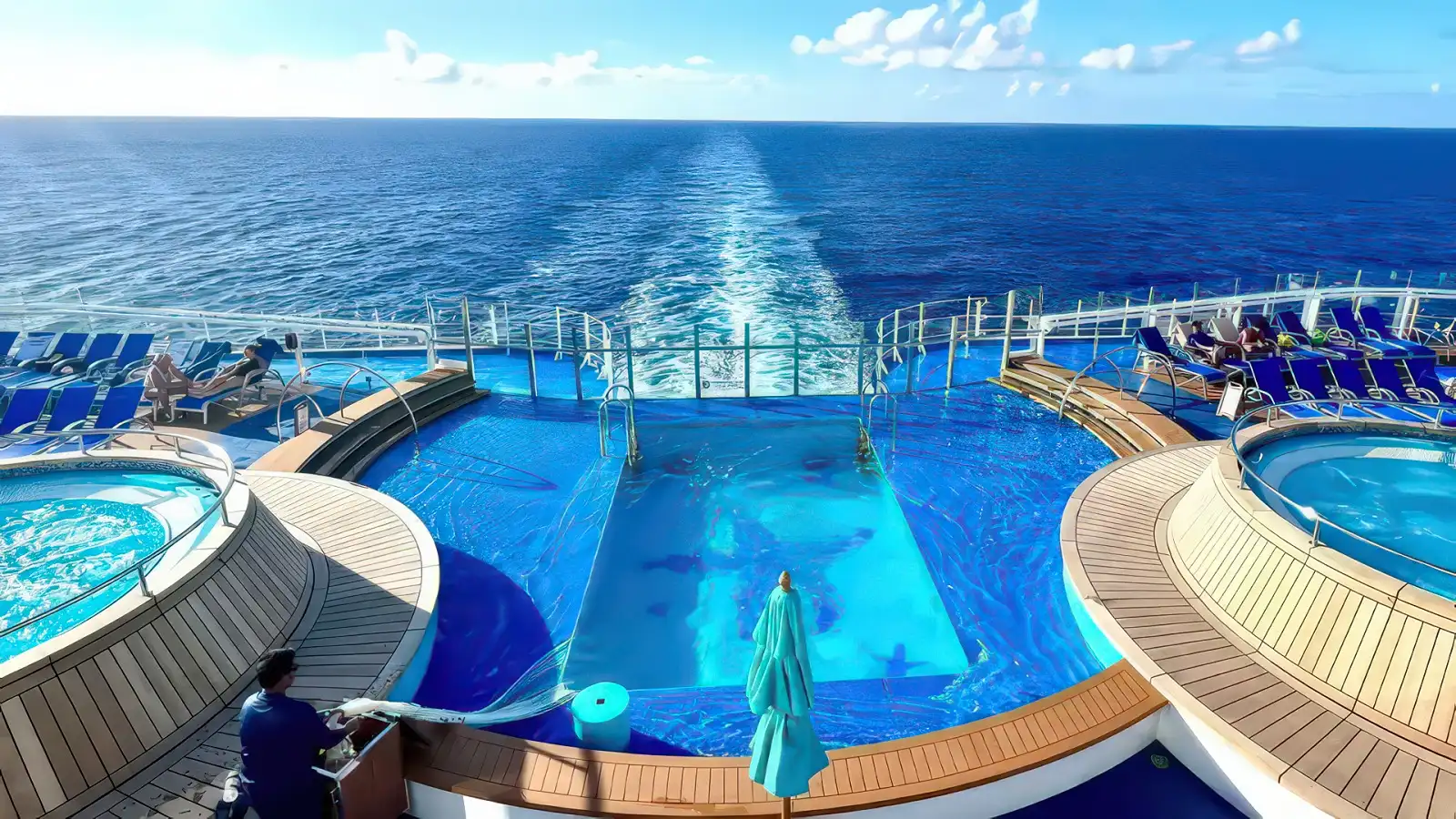 Carnival pool deck busy with guests on a sunny day