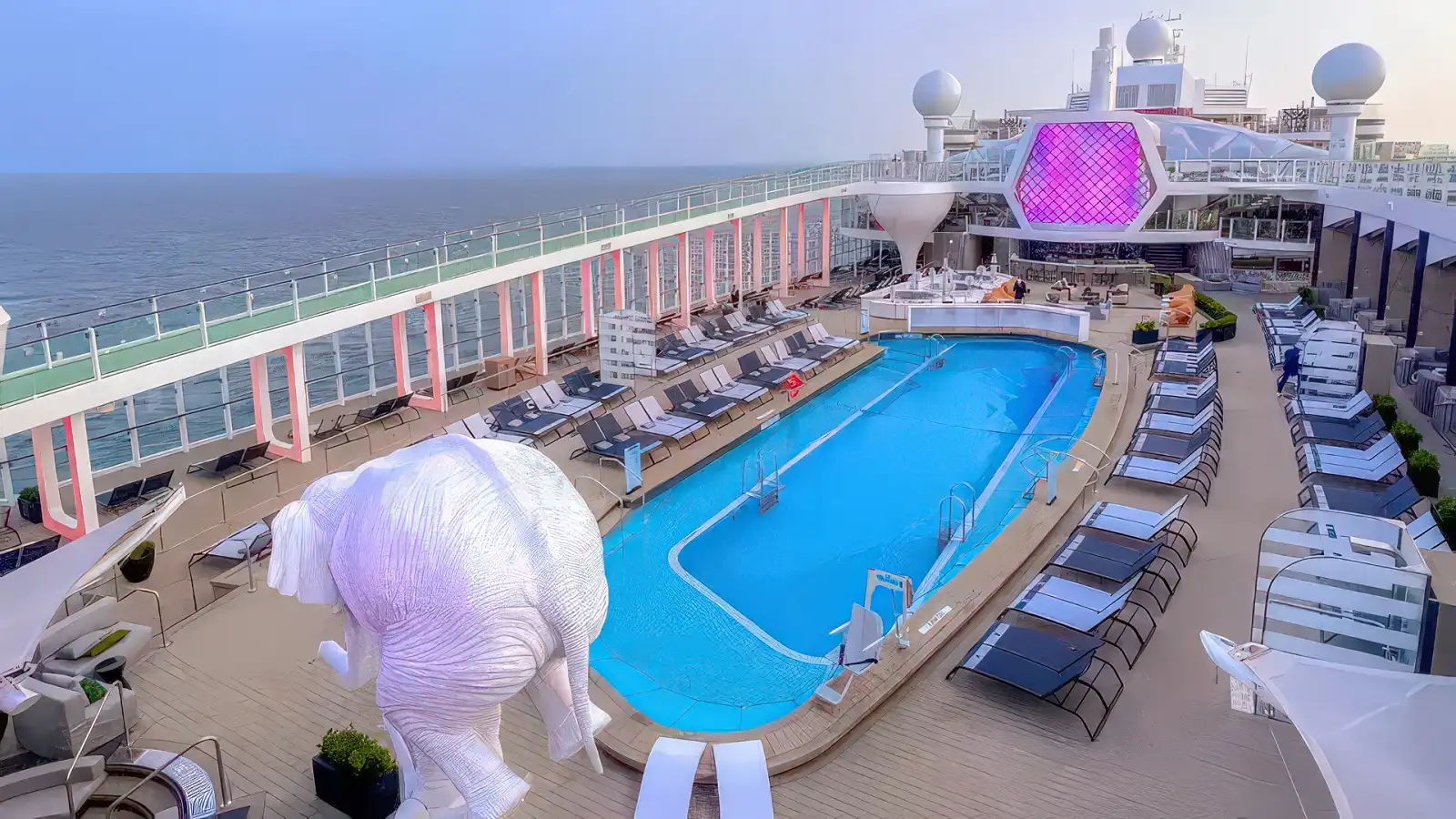 The open resort-style pool deck aboard Celebrity Beyond