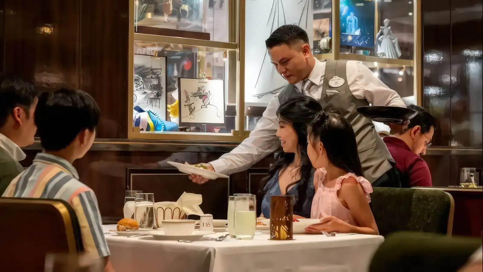 An elegant Disney ship restaurant set for dinner