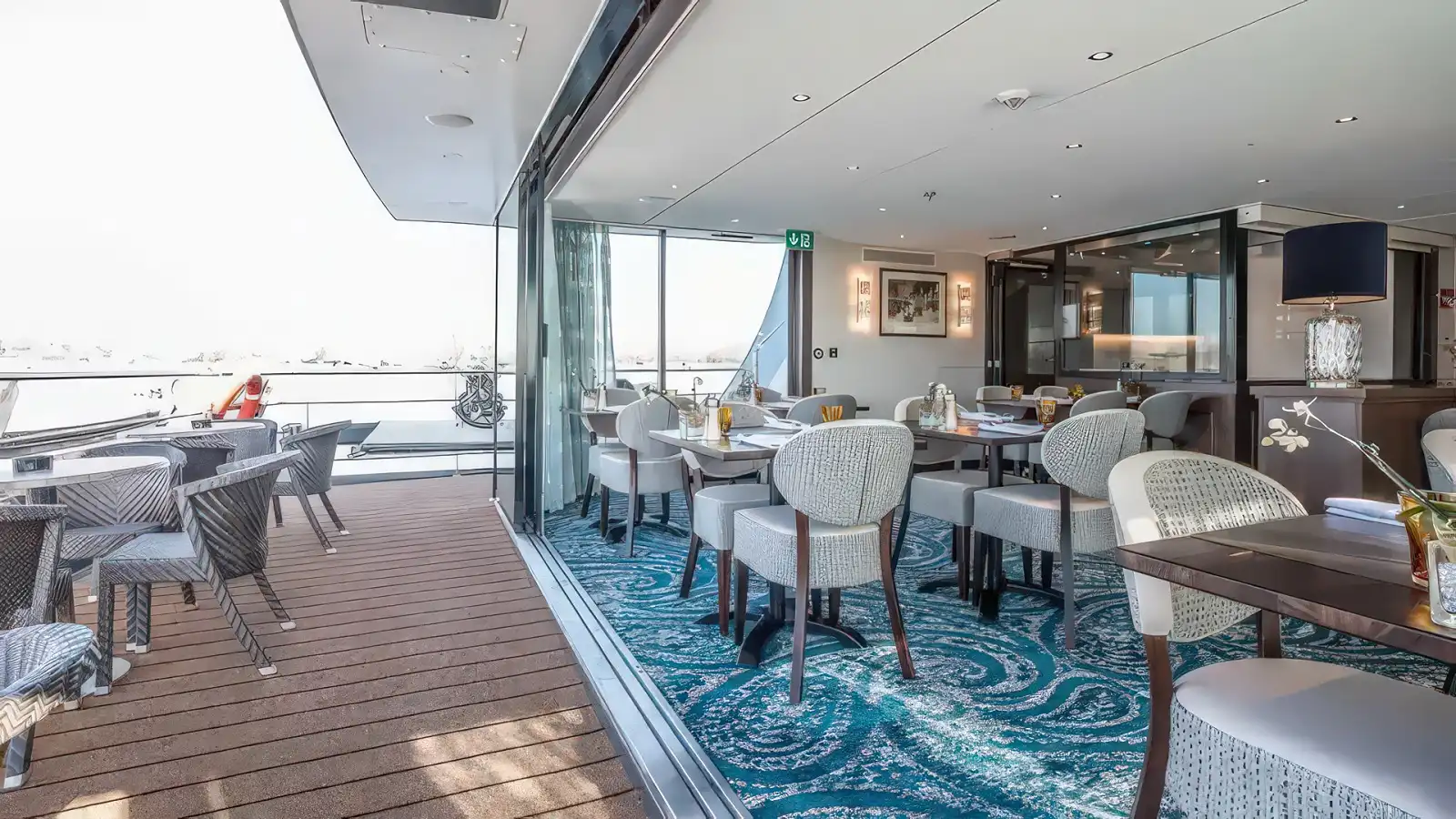 Guests taking in the view from the sun deck of a Riviera River Cruises ship