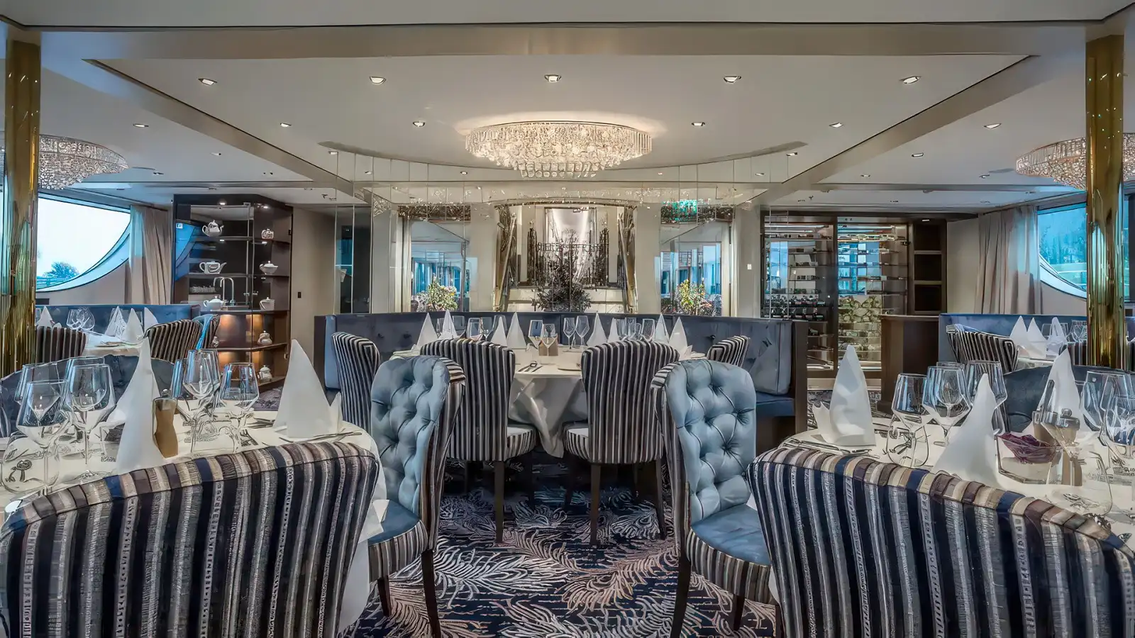 The main dining room aboard a Riviera River Cruises ship set for dinner