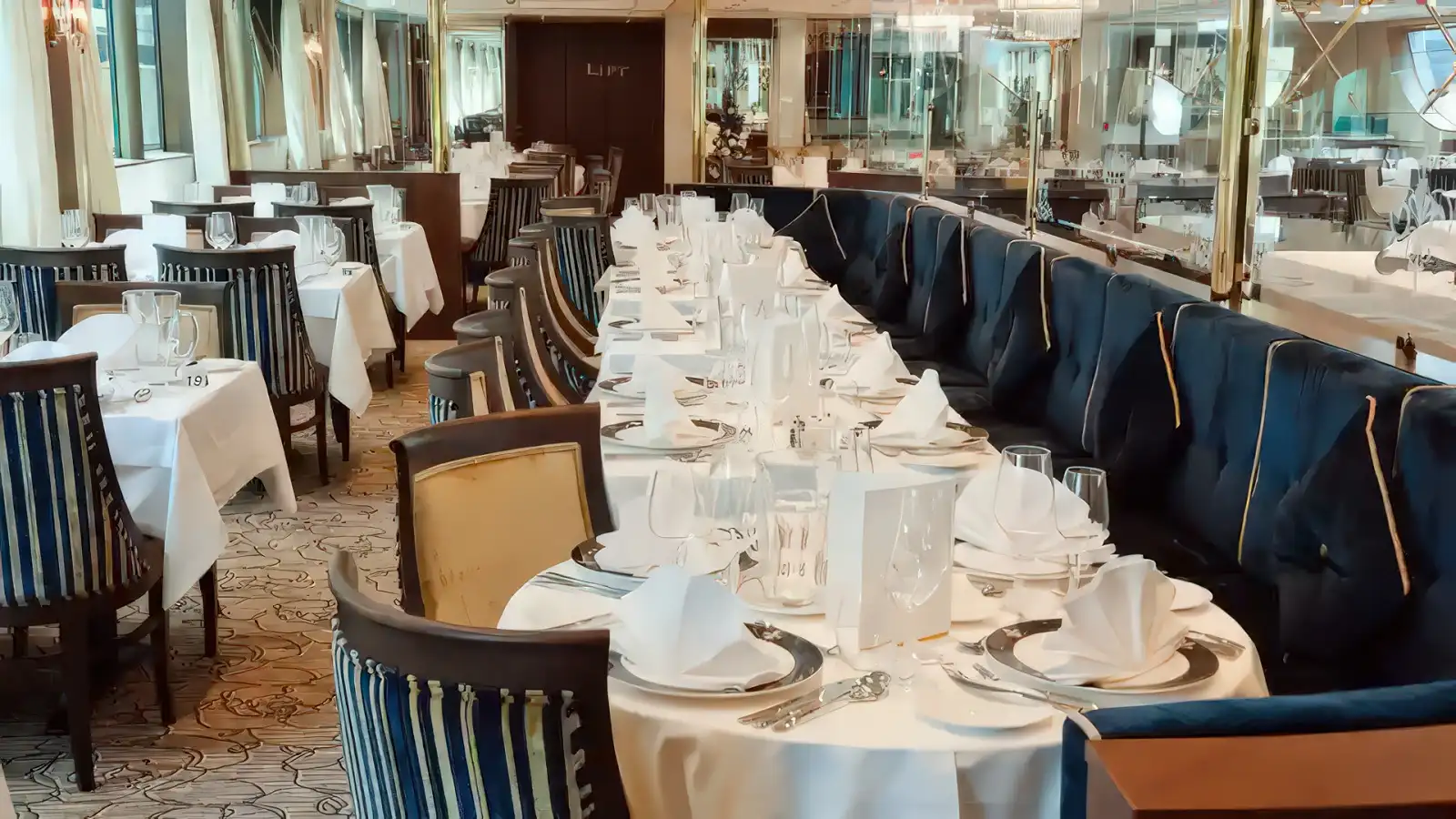 A dinner service in the main restaurant of a Tauck riverboat