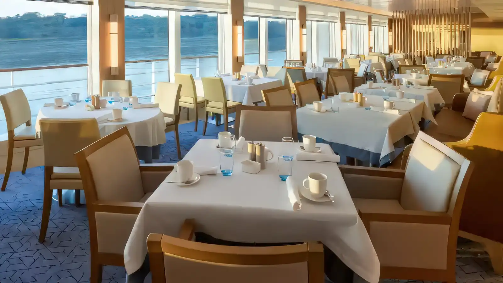 The main dining room aboard a Viking Longship set for dinner