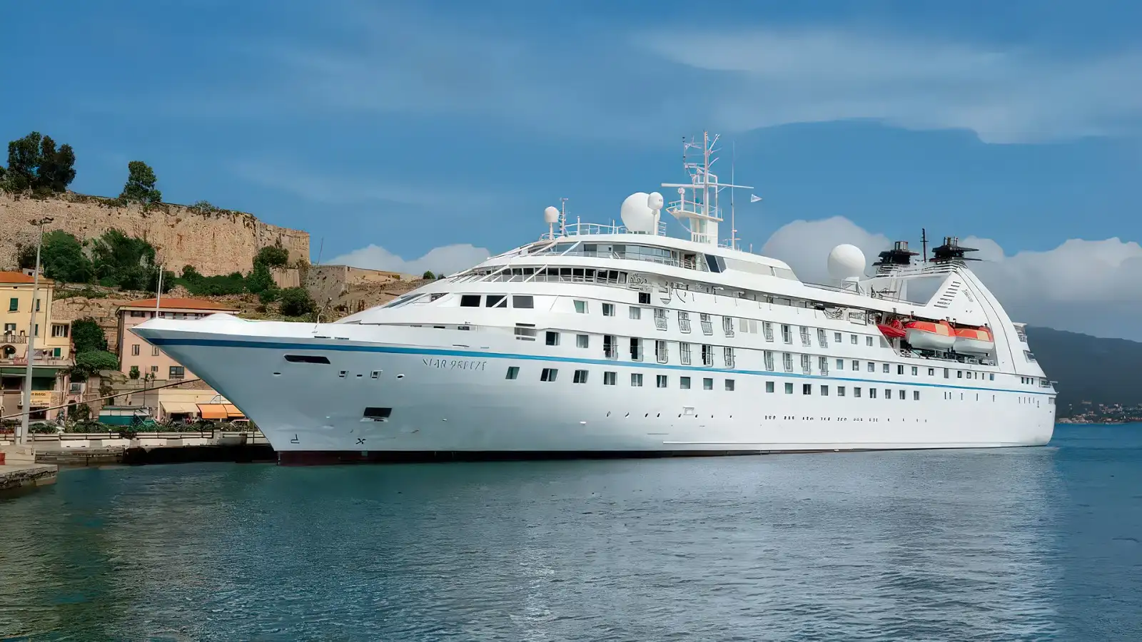 The Windstar power yacht Star Breeze at anchor in a calm bay