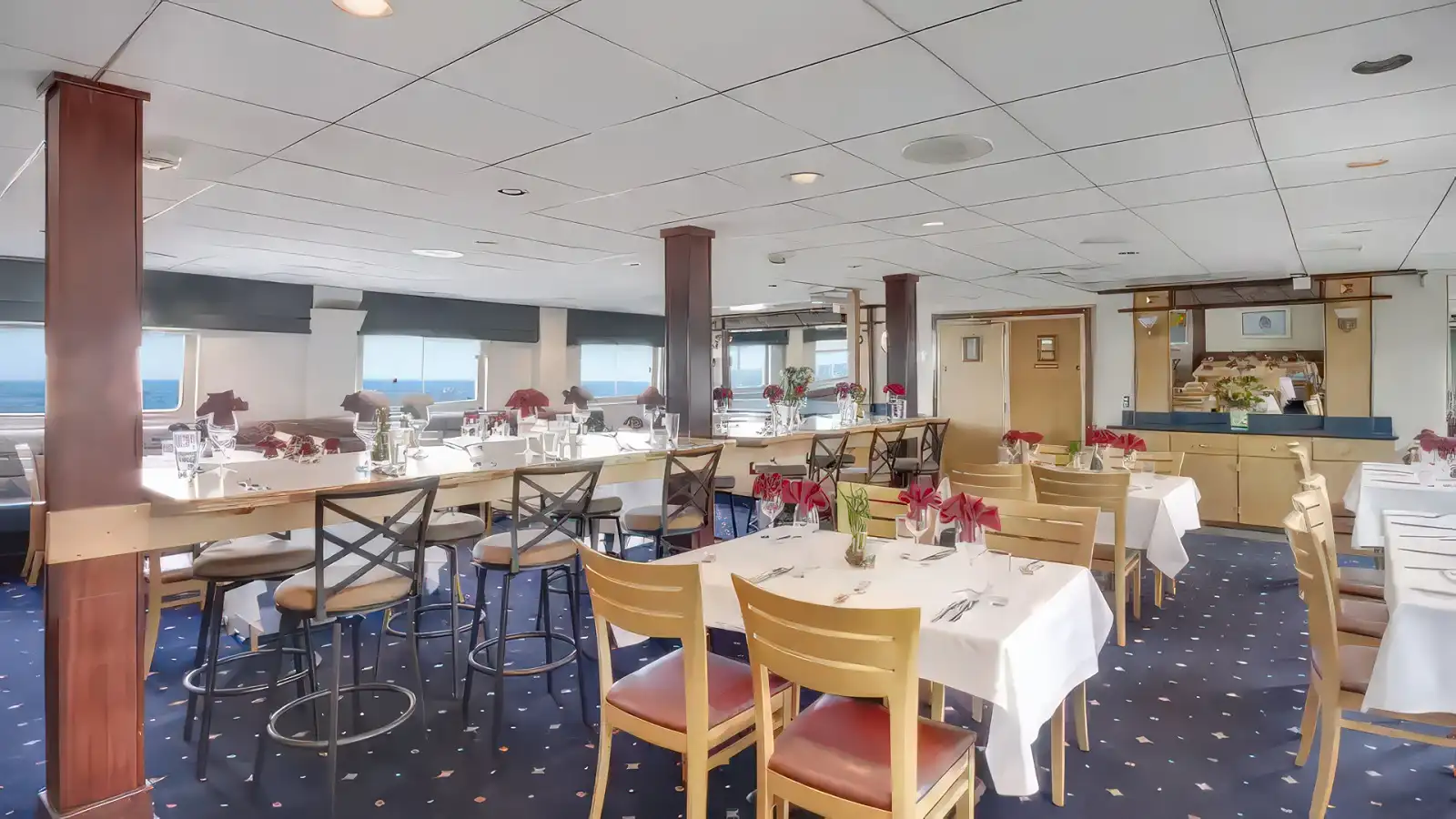 Guests sharing a casual meal aboard an UnCruise Adventures ship