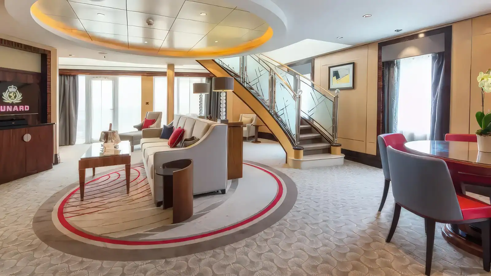 An elegant Cunard suite with rich fabrics and a sitting area