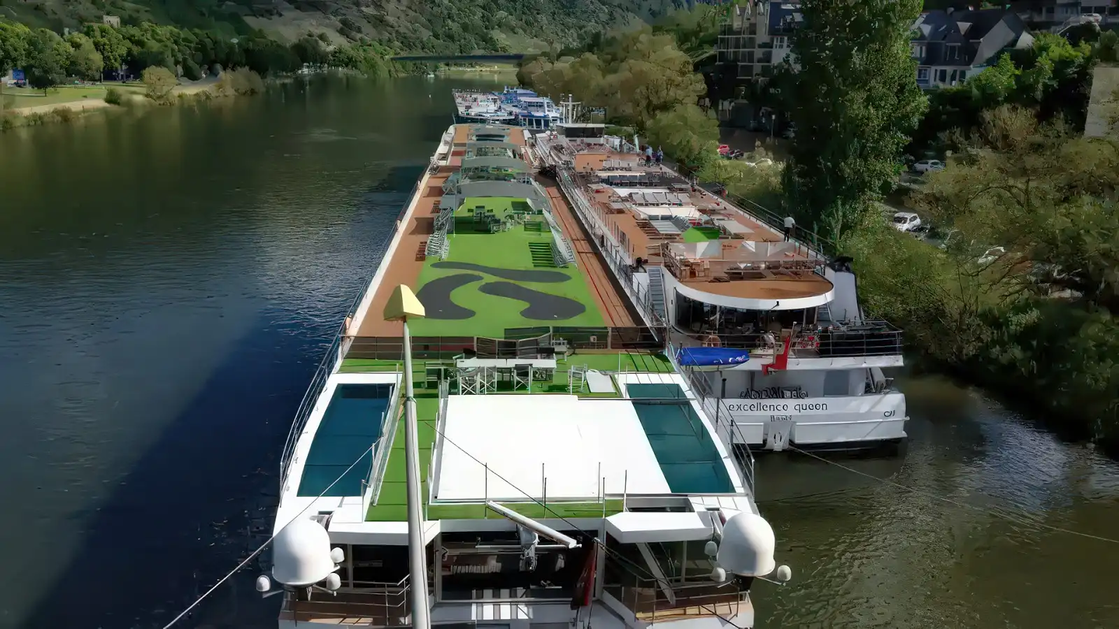 An Emerald Cruises Star-Ship moored at a riverside quay in the evening