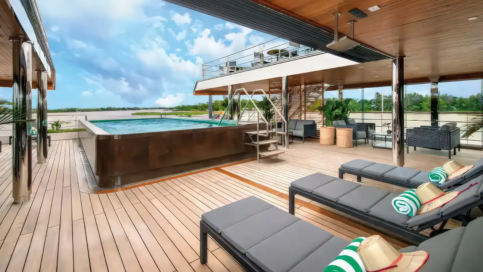 The indoor heated pool aboard an Emerald Cruises Star-Ship with its glass roof open