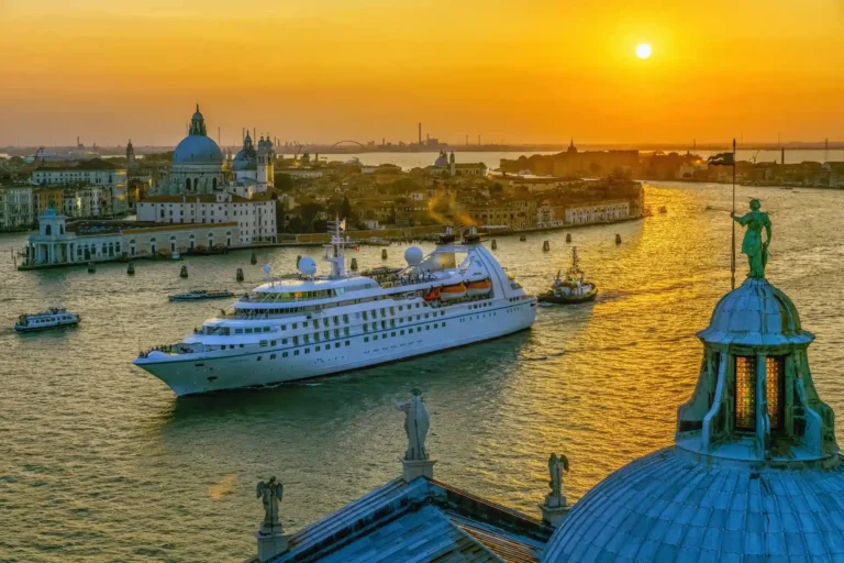A ship anchored off a historic Mediterranean port